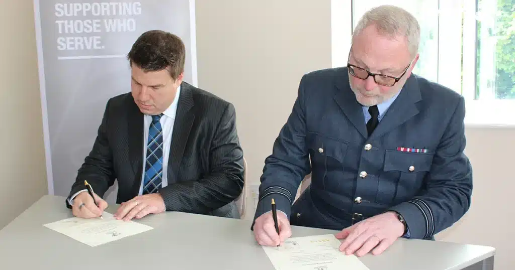 Neil Pertoldi, GM Abels Moving Services, with Squadron Leader Mark Fixter