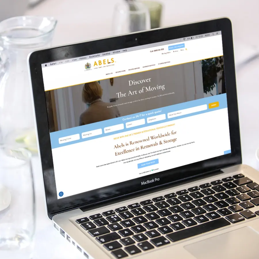 Abels New Website on laptop